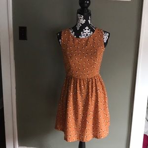 Cute orange and patterned printed midi dress.